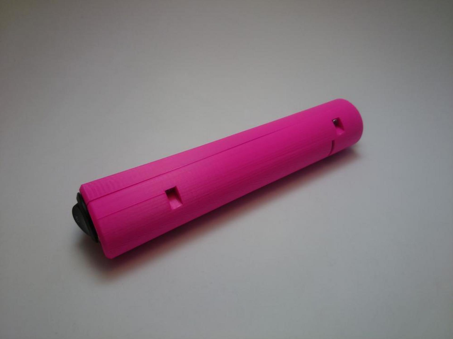 The final prototype of Vibrette. A long pink stick with a switch on the bottom and a button on the top.