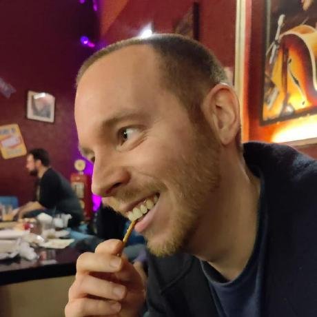 Michael, laughing, with a snack